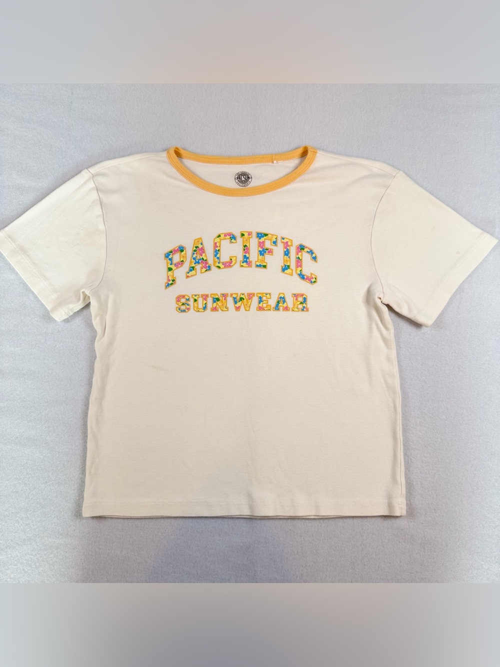 PacSun Cream Tee with Yellow Ringer and Multicolor Floral Letters